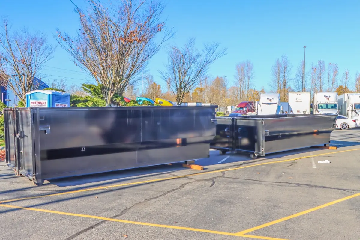 Professional dumpster rental service with roll-off container on residential driveway in Cahokia Heights